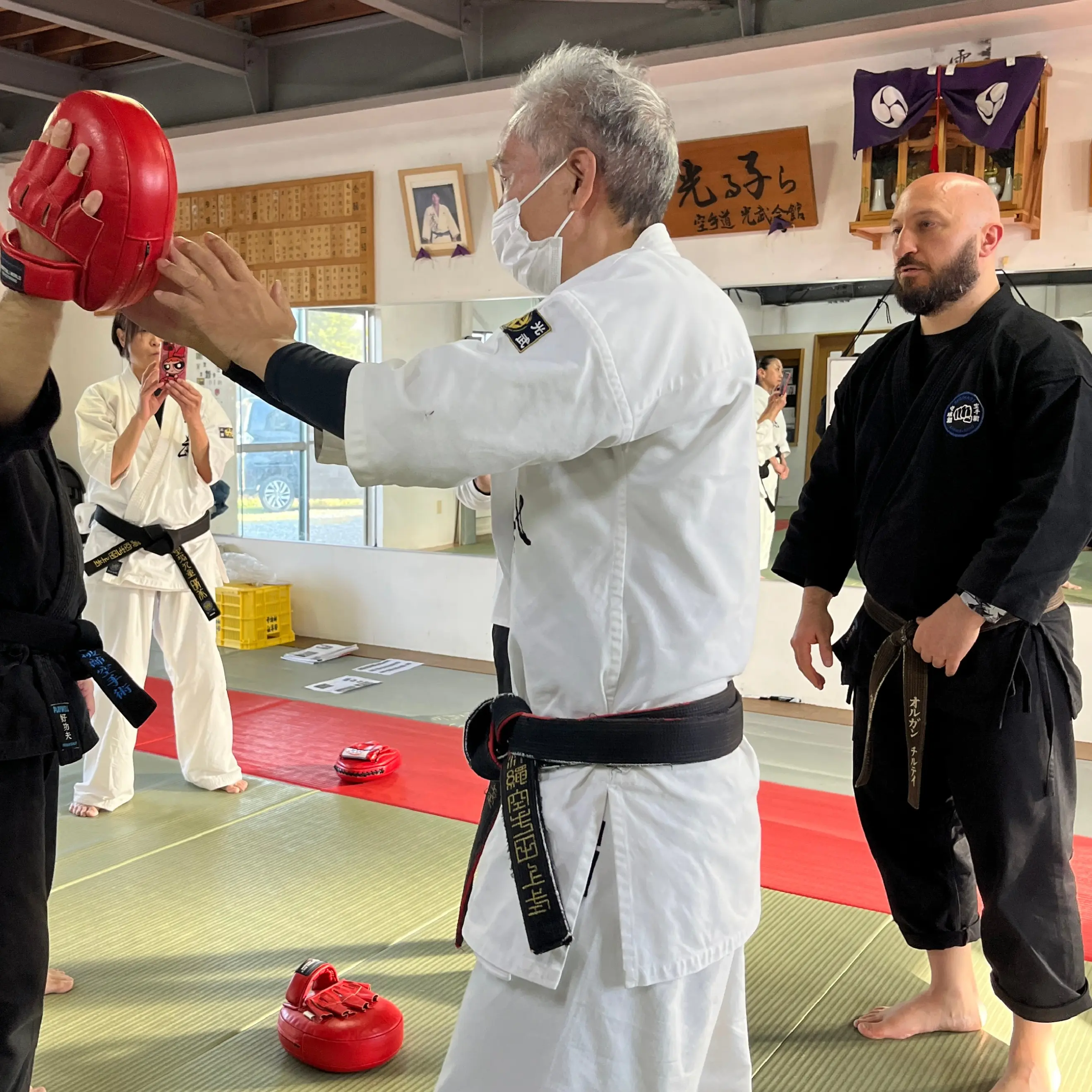 Olgun Tiltay learning rapid  impact drills from Nobuya Tagami Sensei [9th Dan Tomarite Karate] in Ise Japan